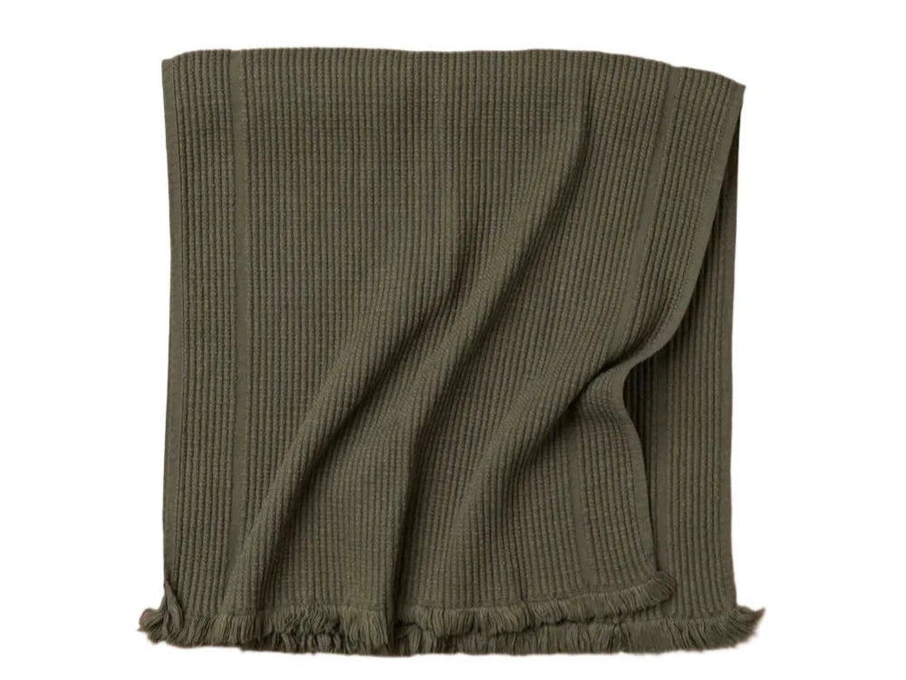 A green olive-colored vintage wash towel with a short terry weave, part of the Saardé Olive Bath Mat collection.